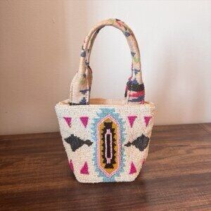 America & Beyond Beaded Artistic Handbag with white and multicolor patterns.